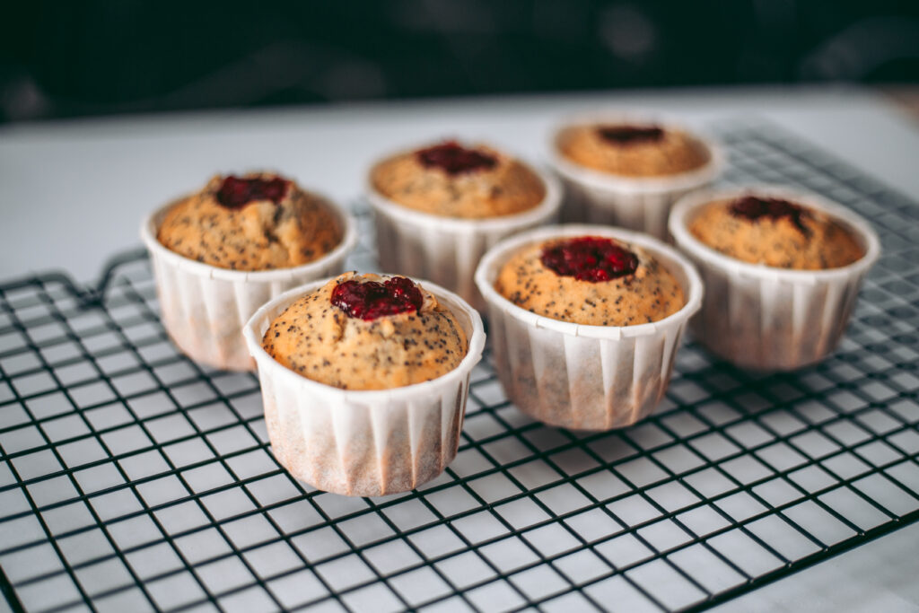 Recyclable Muffin Cups That Maintain Quality In 24x7 Baking delicious appetizing fresh baked muffins in the kitchen close up