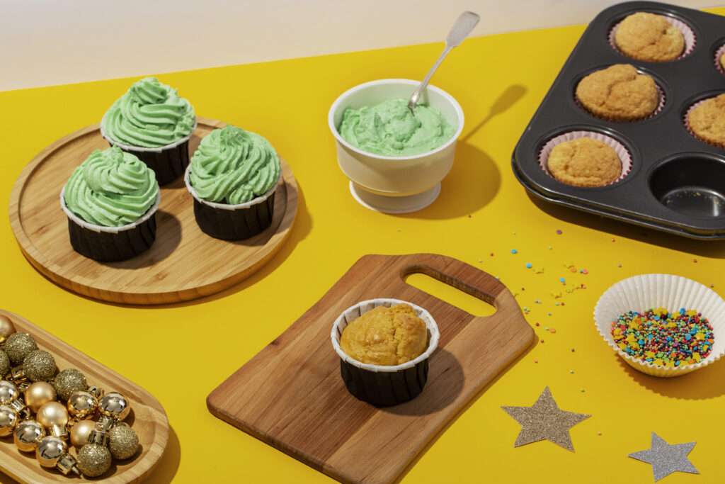 Recyclable Muffin Cups That Support Continuous Baking At Scale high angle tasty cupcakes assortment