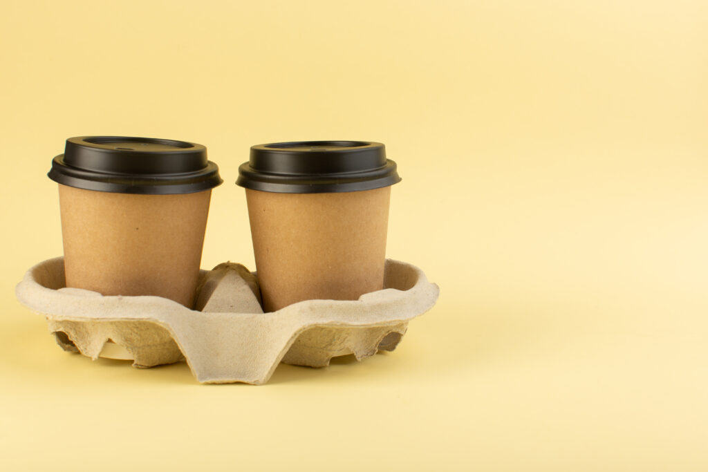 Recyclable Muffin Cups For Controlled High Volume Output front view plastic coffee cups delivery coffee pair yellow wall